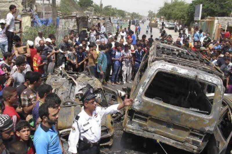 Two car bombs exploded in busy markets in Sadr City, north-eastern Baghdad, killing at least 11 people and wounding another 18.