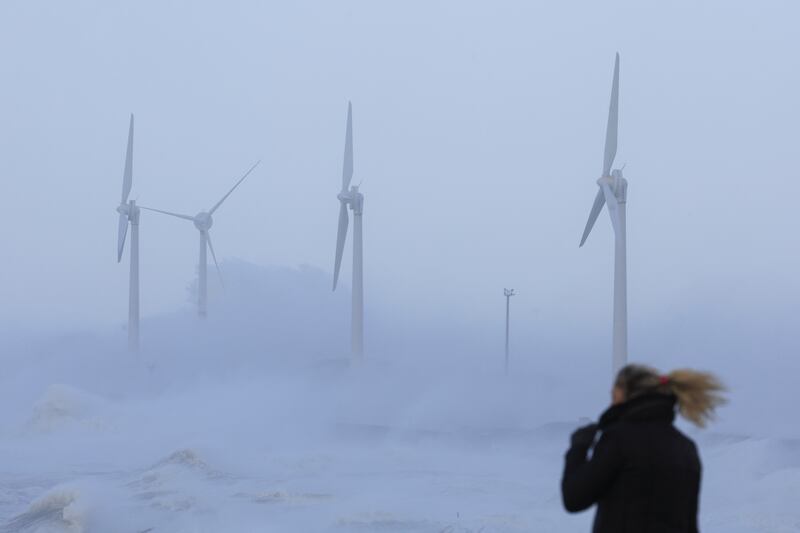 Waves crash against wind turbines during Storm Eunice in Boulogne-sur-Mer, France. Reuters