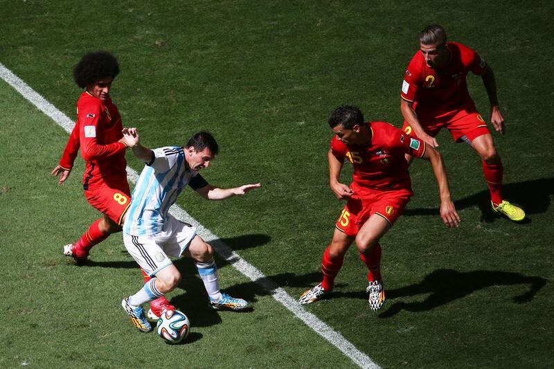 Marouane Fellaini of Belgium challenges Lionel Messi of Argentina during their match on Saturday at the 2014 World Cup in Brasilia, Brazil. Jamie Squire / Getty Images