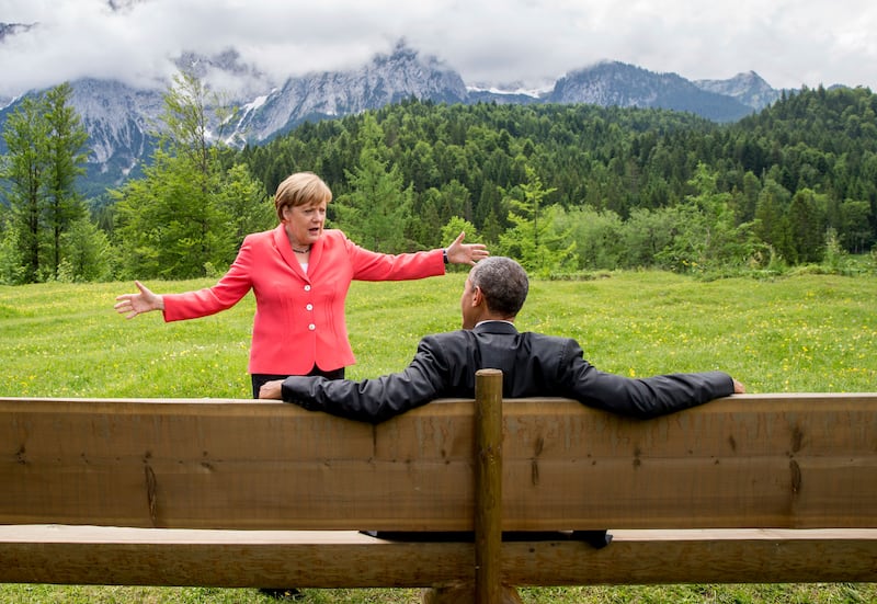 Mrs Merkel speaks with former US president Barack Obama during a G7 summit in 2015. AP Photo