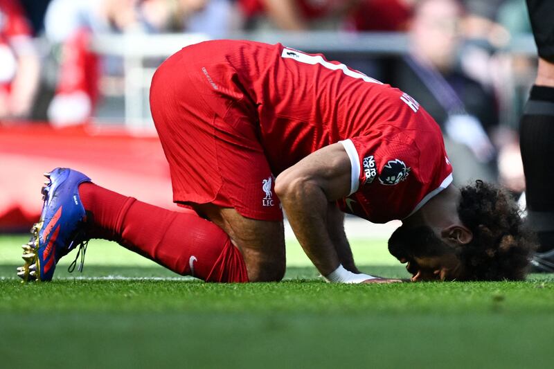 Liverpool's Egyptian striker Mohamed Salah offers his customary prayer of thanks after scoring. AFP