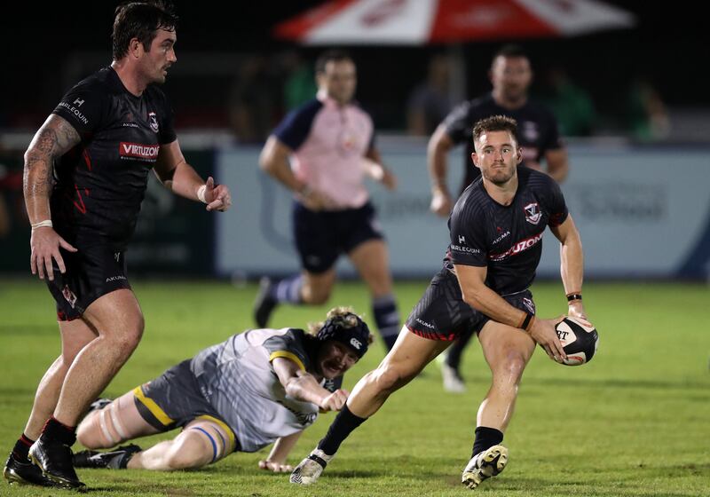 Exiles' Conor Kennedy is tackled by Canes' Seb Dando during the UAE Premiership match between Dubai Exiles and Dubai Hurricanes at The Sevens in Dubai on Friday, November 6, 2021. All images Chris Whiteoak / The National