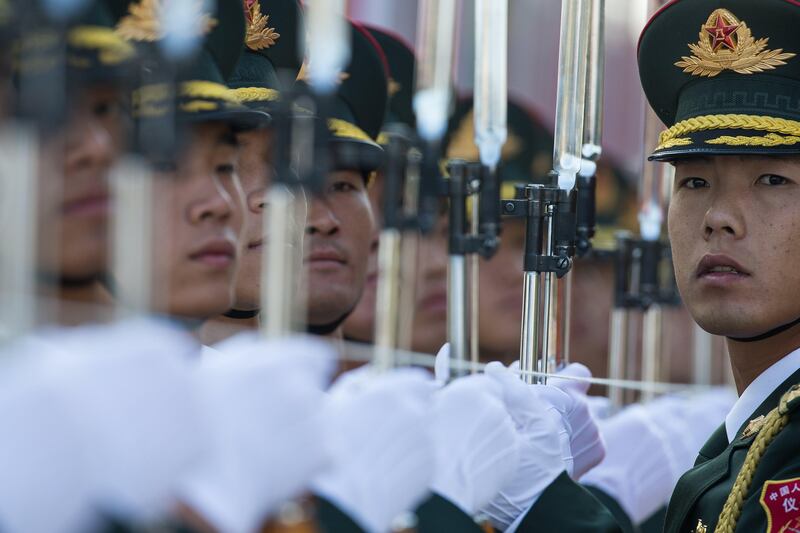 Soldiers of the Chinese People's Liberation Army honour guard prepare for a welcoming ceremony for Russian Prime Minister Dmitry Medvedev at the Great Hall of the People in Beijing, China.  Roman Pilipey / EPA