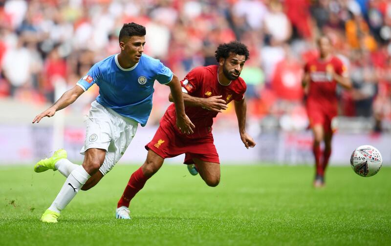 Mohamed Salah of Liverpool battles for possession with Rodri of Manchester City. Getty Images