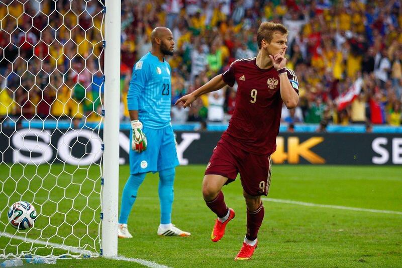 Aleksandr Kokorin of Russia scores the opening goal to put Russia up 1-0 on Thursday against Algeria at the 2014 World Cup in Curitiba, Brazil. Clive Rose / Getty Images