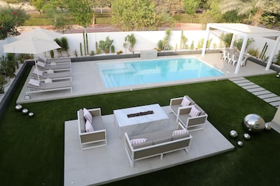 Darren and Hayley Bingley's back garden pool is inspired by Palm Springs and Mykonos. Chris Whiteoak / The National