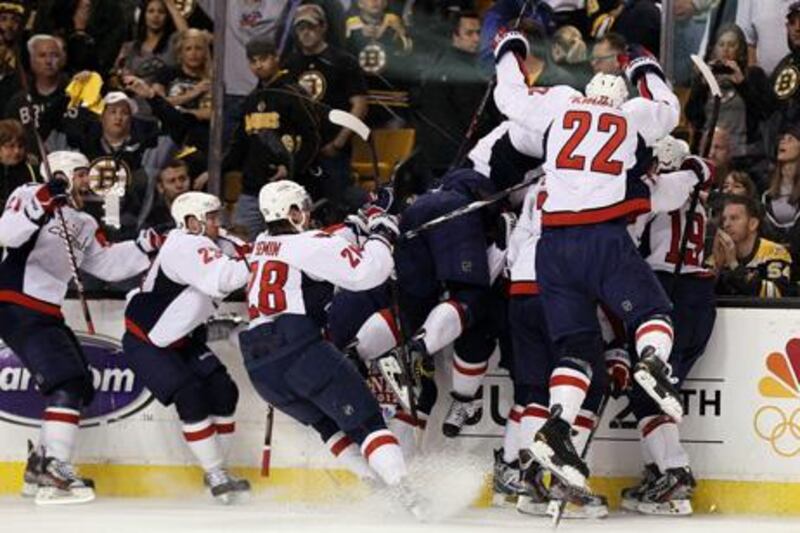 BOSTON, MA - APRIL 25: The Washington Capitals celebrate the overtime win after Game Seven of the Eastern Conference Quarterfinals during the 2012 NHL Stanley Cup Playoffs at TD Garden on April 25, 2012 in Boston, Massachusetts. The Washington Capitals defeated the Boston Bruins 2-1 in overtime.   Elsa/Getty Images/AFP== FOR NEWSPAPERS, INTERNET, TELCOS & TELEVISION USE ONLY ==

