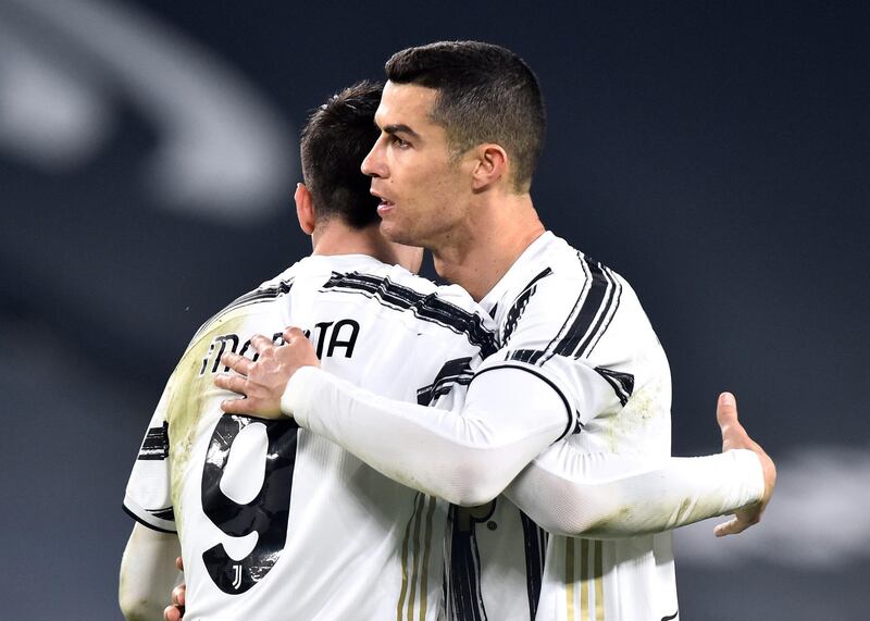 Juventus' Cristiano Ronaldo celebrates scoring their third goal with Alvaro Morata. Reuters