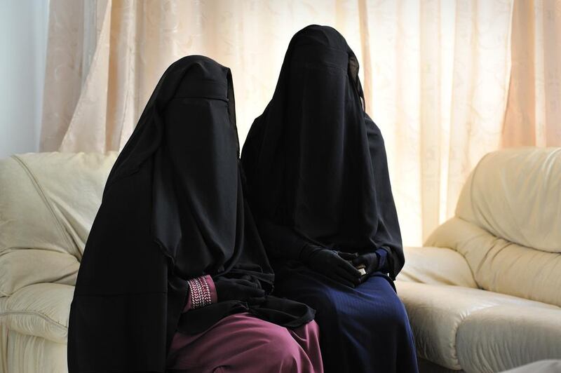 Imen Mimouni and Soumaya Jabbari - two of the students asking to be able to attend classes and sit exams while wearing the niqab - sit in the foyer of the administration building at Manouba University on 24 January 2012. Lindsay Mackenzie for The National.