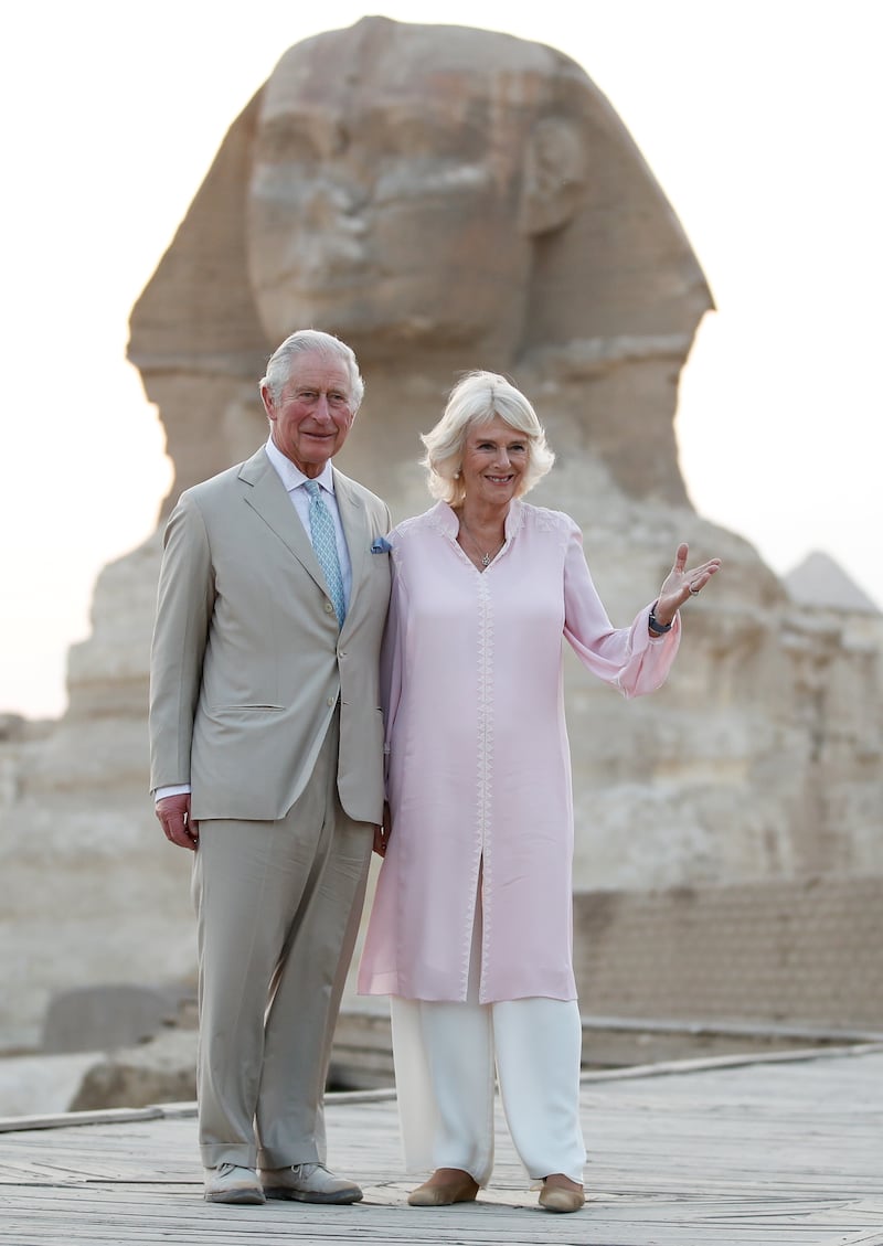 Prince Charles and the Duchess of Cornwall pose in front of the Sphinx, on the outskirts of Cairo in November 2021