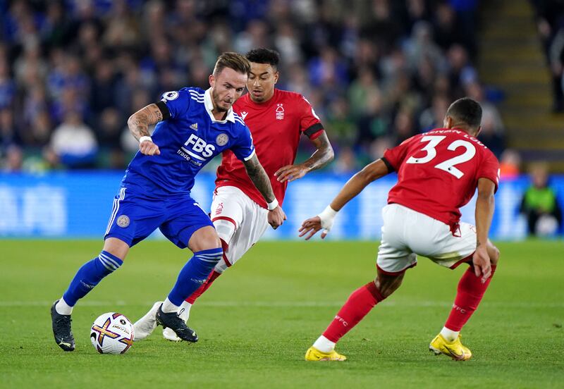 James Maddison runs with the ball under pressure from Jesse Lingard. PA