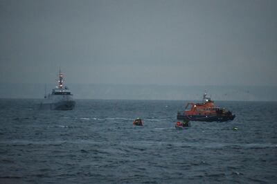 French and British vessels taking part in the rescue operation after the boat capsized. AFP 