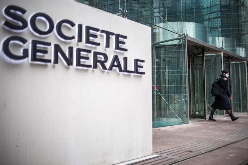 epa08298004 A woman wearing a protective mask leaves French Bank 'Societe Generale' headquarters in La Defense Paris' business district, on the day 2 of the measures to contain the spread of coronavirus SARS-CoV-2 which causes the Covid-19 disease, in Paris, France, 16 March 2020. La Defense is the largest French business place where most of the CAC40 companies located their headquarters. French Prime Minister Edouard Philippe announced on 14 March 2020 that all places that are not essential to French living, including restaurants, cafes, cinemas and clubs, will be closed from 15 March 2020 until further notice. President Macron announced the closing of schools, high schools and nurseries from 16 March 2020 on.  EPA/CHRISTOPHE PETIT TESSON