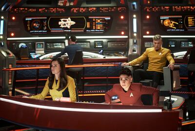 From left, Rebecca Romijn as Una, Ethan Peck as Spock, background, Melissa Navia as Ortegas and Anson Mount as Pike in a scene from the series 'Star Trek: Strange New Worlds'. AP