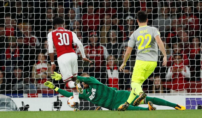 Arsenal's Ainsley Maitland-Niles in action against Cologne player Timo Horn. David Klein / Reuters