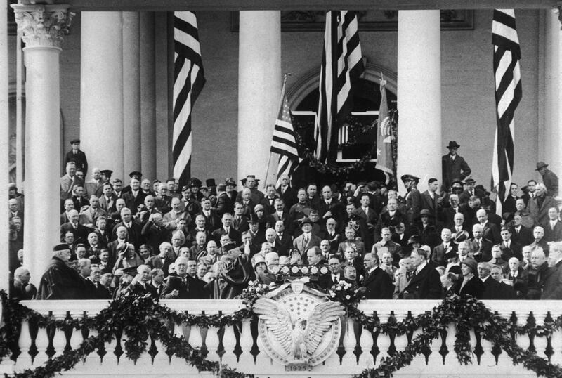 4th March 1924:  American president Calvin Coolidge (1872 - 1933) takes the oath of office at his Inauguration ceremony, Washington, DC. William Howard Taft, Supreme Court Justice and former President, presides over the ceremony.  (Photo by New York Times Co./Getty Images)