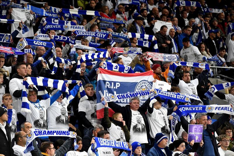 Leicester City fans wearing Vichai Srivaddhanaprabha shirts that read 'The Boss' and waving their scarves in remembrance of the Leicester City chairman and victims of the helicopter crash dduring the English Premier League soccer match between Cardiff City and Leicester City at the Cardiff City Stadium, Cardiff. Wales.AP