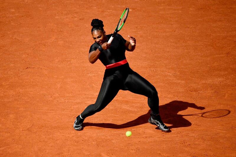 (FILES) In this file photo taken on May 29, 2018 Serena Williams of the US plays a forehand return to Czech Republic's Kristyna Pliskova during their women's singles first round match on day three of The Roland Garros 2018 French Open tennis tournament in Paris. - Williams downplayed any idea of friction between herself and the French Tennis Federation on August 25, 2018, after Roland Garros chiefs described the "Black Panther" catsuit she wore at the French Open as "going too far". "I think that obviously the Grand Slams have a right to do what they want to," the 23-time Grand Slam champion said as she met reporters in Flushing Meadows, New York, where the US Open begins on Monday. (Photo by CHRISTOPHE SIMON / AFP)