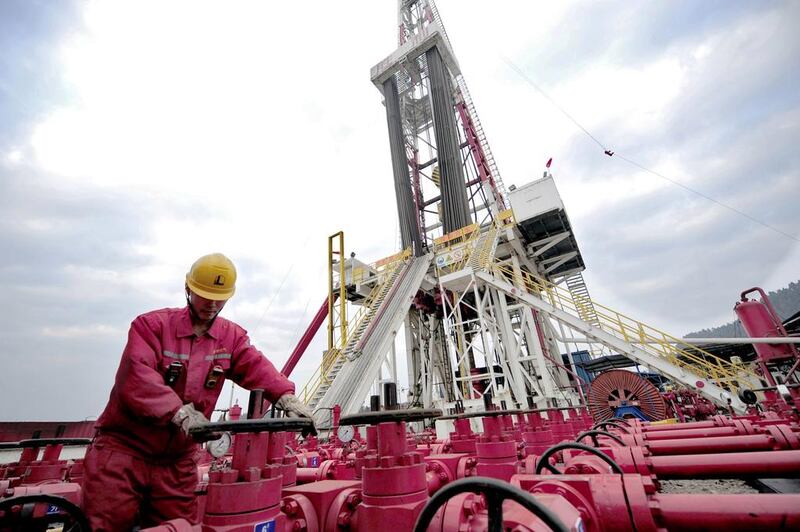 China explores for shale gas in the hope of replicating the energy bonanza in the United States. Above, a worker checks on the valves at a natural gas appraisal well in Sichuan. Reuters
