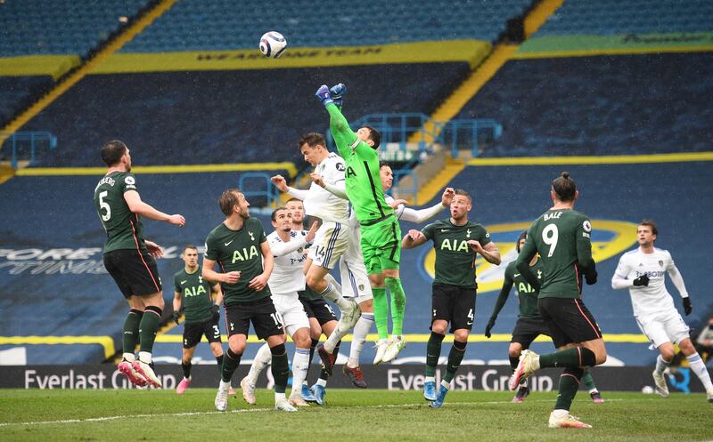 Spurs goalkeeper Hugo Lloris punches clear. Reuters