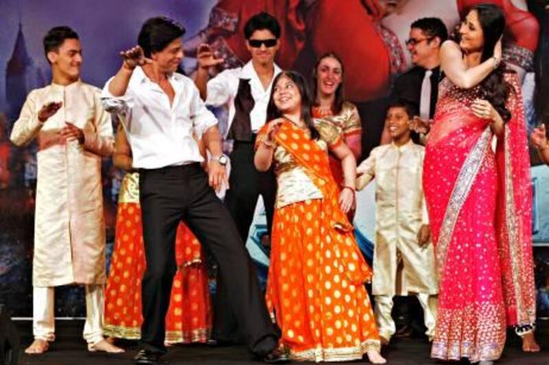 Dubai - October 24, 2011- Bollywood movie star Shah Rukh Khan and Kareena Kapoor dance to the song "Chamak Chalo" from his new movie Ra. One with hearing impaired students from the Rashid Pediatric Therapy Centre at a benefit dinner in the Granh Hyatt Hotel after the world premiere screening of Ra. One at the Grand Cineplex in Dubai, October 24, 2011. (Photo by Jeff Topping/The National) 

 