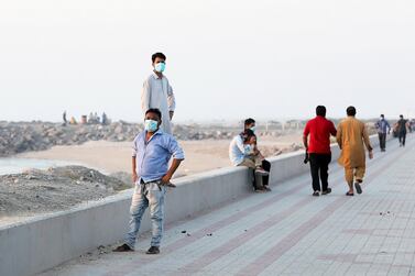 RAK, UNITED ARAB EMIRATES , May 28 – 2020 :- People wearing protective face mask as a preventive measure against the spread of coronavirus during the evening near the beach area in Ras Al Khaimah. UAE government lift the coronavirus restriction for the residents and businesses around the country. (Pawan Singh / The National) For News/Online/Stock/Instagram.