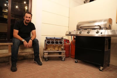 DUBAI, UNITED ARAB EMIRATES , Feb 07 – Christopher Dabell made the gas grill out of car engine at his villa in the Mudon community in Dubai. (Pawan Singh / The National) For Business/Online/Instagram. Story by David