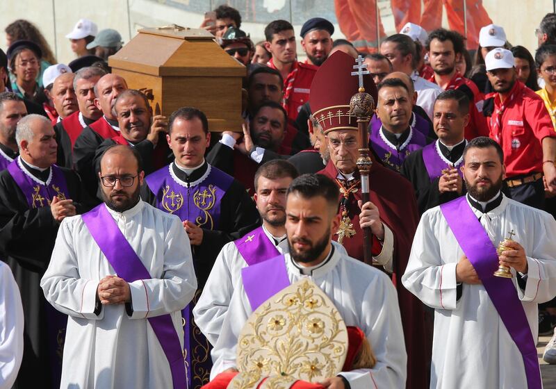 Maronite monks carry the coffin of late Cardinal Nasrallah Sfeir at the Maronite Patriarchate Square, in Beirut. EPA