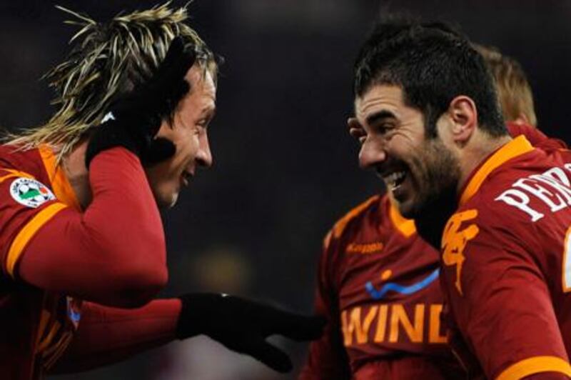 Roma's Philippe Mexes, left, celebrates scoring against Udinese  on Thursday.