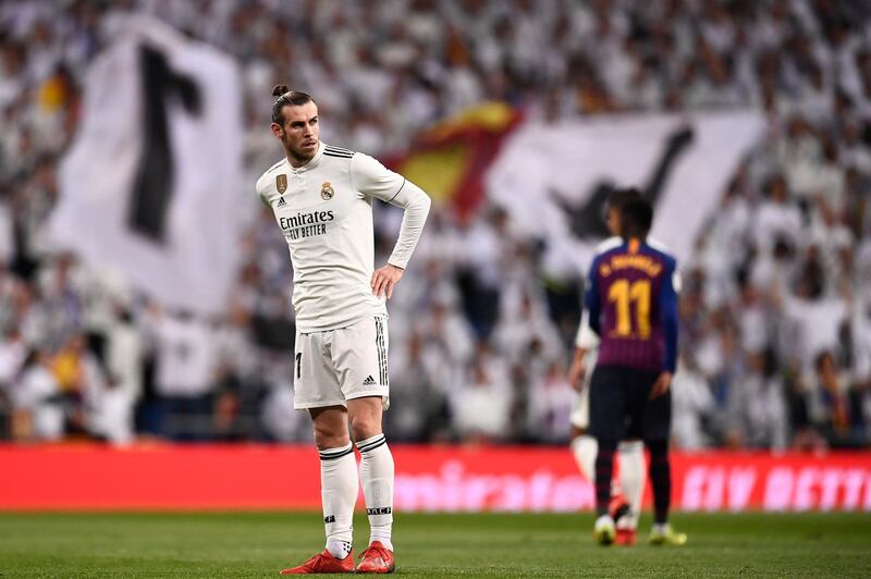 Gareth Bale looks on during the Spanish league defeat to Barcelona at the Santiago Bernabeu stadium on March 2. He was whistled off in the second half. AFP