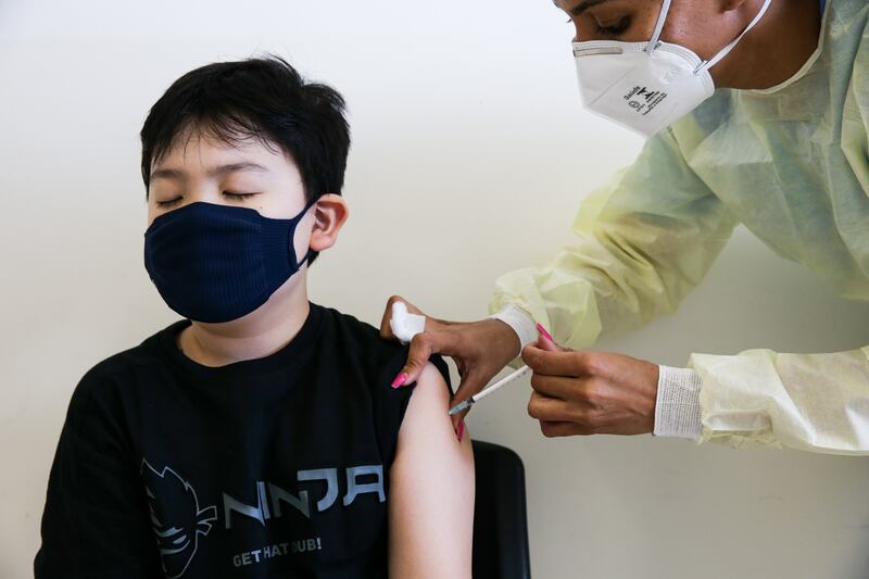 Lucas Sudo receives a dose of Pfizer-BioNTech’s vaccine as part of the first group of children under 12 to be immunised against Covid-19 in Sao Paulo, Brazil. Getty Images