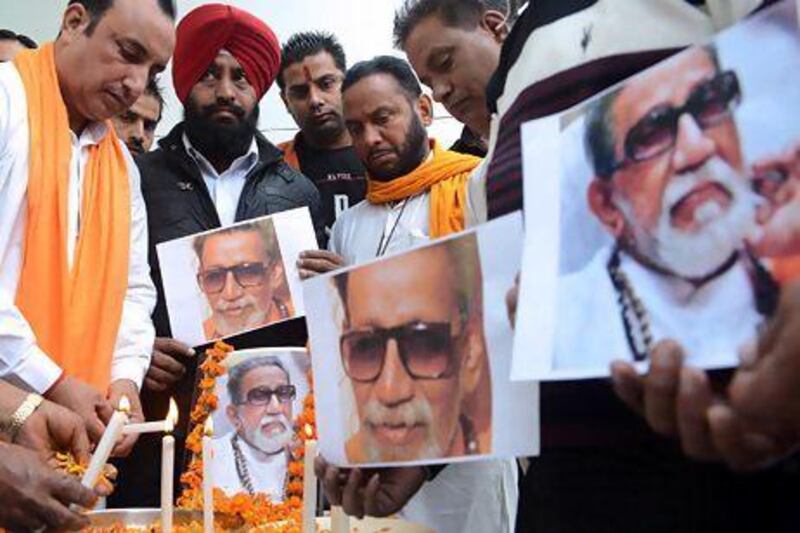 Members of the Indian Hindu nationalist Shiv Sena party light candles as they pay tribute to Bal Thackeray.