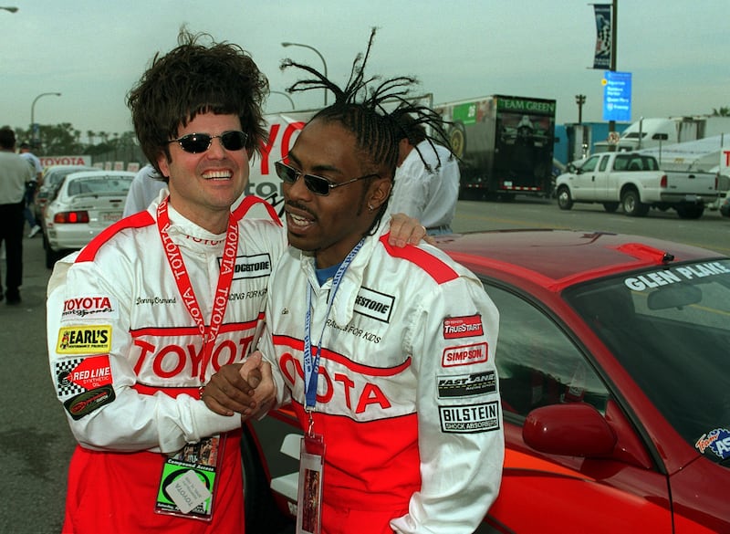 Donny Osmond and Coolio exchange pose together at the Toyota Celebrity race in Long Beach in April 1999. Getty Images 