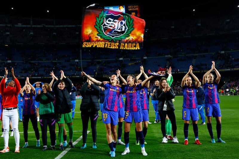 Barcelona players celebrate their 5-2 win against Real Madrid in the Women's Champions League quarter-final second leg with the fans in a record 91,553 crowd at Camp Nou on Wednesday, March 30, 2022. AP 