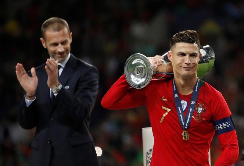 Cristiano Ronaldo with the Nations League trophy. Reuters