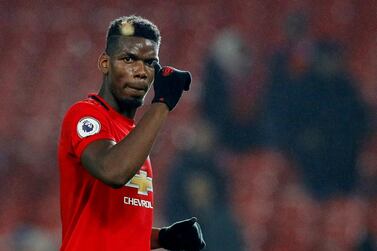 FILE PHOTO: Soccer Football - Premier League - Manchester United v Newcastle United - Old Trafford, Manchester, Britain - December 26, 2019 Manchester United's Paul Pogba acknowledges fans after the match REUTERS/Phil Noble EDITORIAL USE ONLY. No use with unauthorized audio, video, data, fixture lists, club/league logos or "live" services. Online in-match use limited to 75 images, no video emulation. No use in betting, games or single club/league/player publications. Please contact your account representative for further details./File Photo