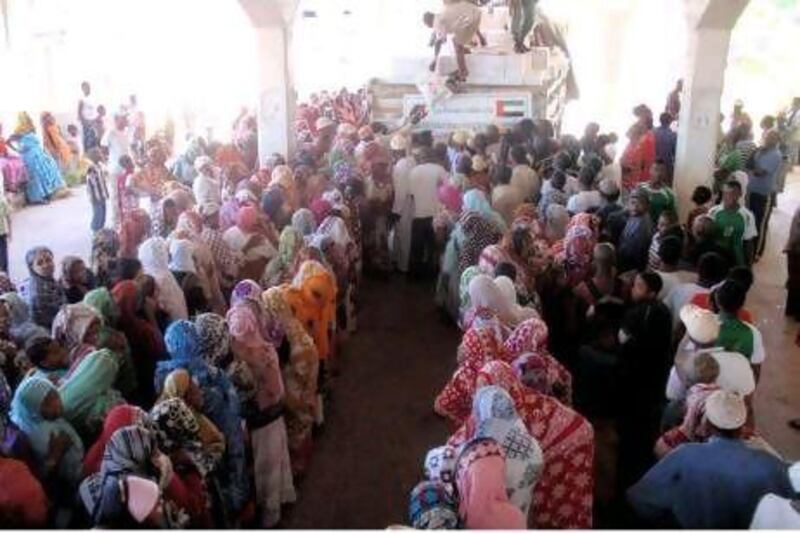 Relief supplies from the Khalifa Foundation are distributed to residents of the Comoros Islands.