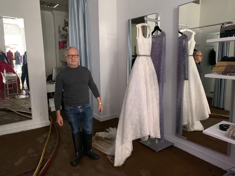 Jacques Azagury, owner of Azagury dress shop, stands next to a destroyed wedding dress which costs £12,000. Photo: Laura O'Callaghan / The National