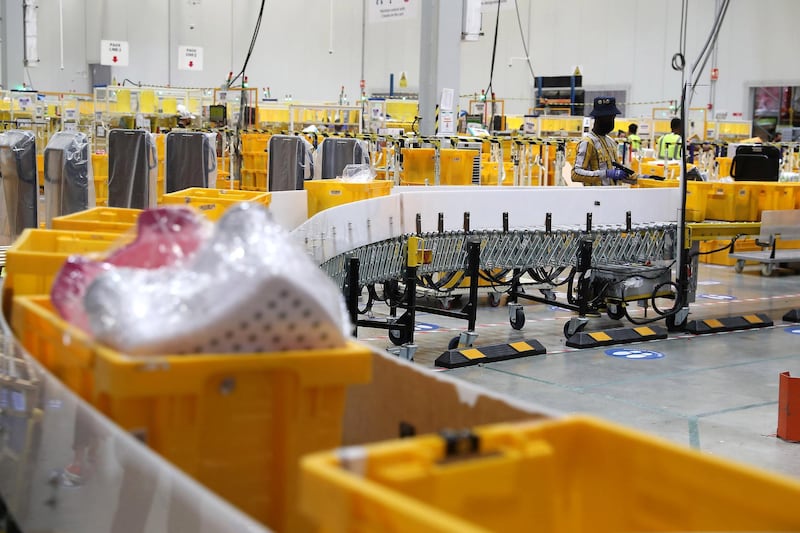 DUBAI, UNITED ARAB EMIRATES , March 18, 2021 –  Carts ready for packing at the Amazon DXB3,  Amazon fulfilment centre in Dubai Logistics City in Dubai. (Pawan Singh / The National) For Lifestyle/Online/Instagram. Story by Farah