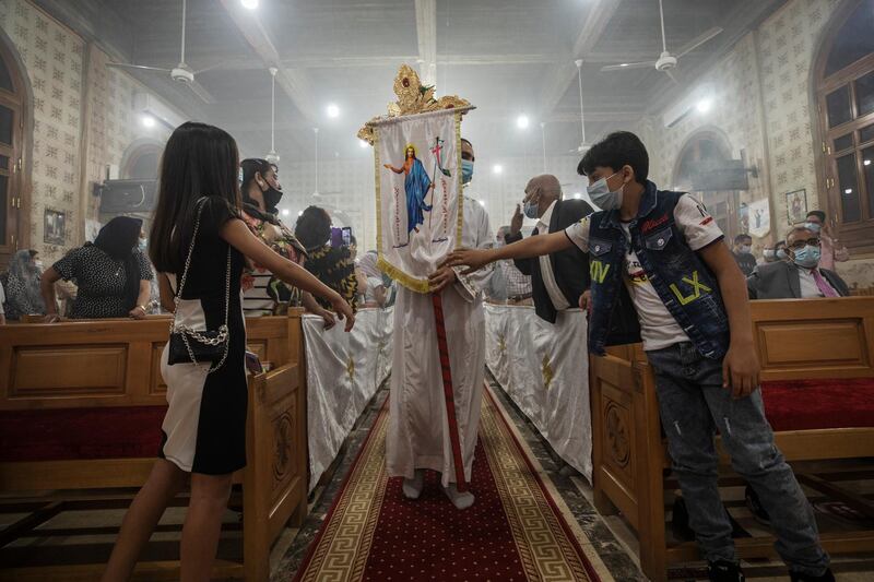 Coptic Orthodox Christians pray during Easter Mass at Holy Cross Church in Cairo. AP Photo