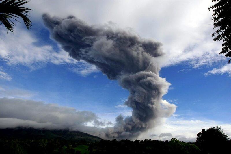 Mount Sinabung spews hot volcanic gas and ashes, seen from Tiga Serangkai village in Karo, North Sumatra, Indonesia. Dedi Sahputra / EPA