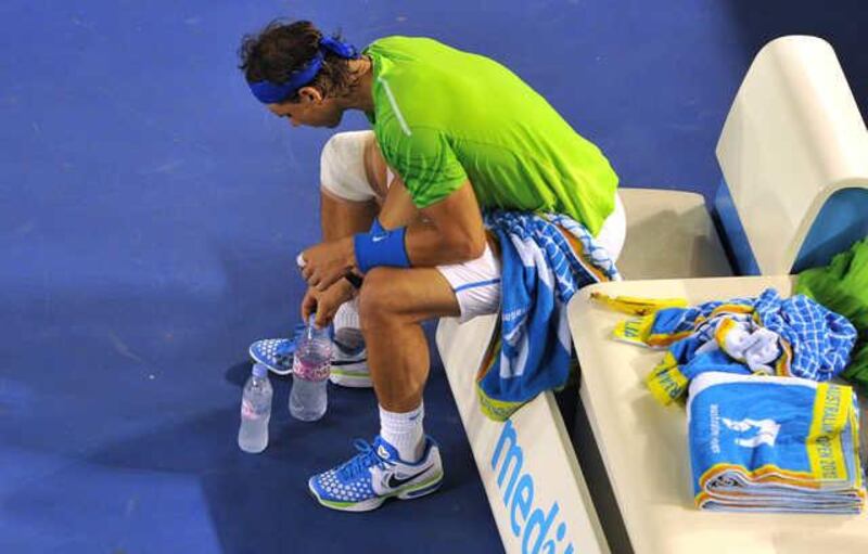 One of Rafael Nadal's habits is arranging his water bottles just so before a match. Nicolas Asfouri / AFP