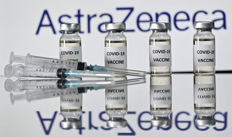 (FILES) In this file photo taken on November 17, 2020 An illustration picture shows vials with Covid-19 Vaccine stickers attached and syringes with the logo of British pharmaceutical company AstraZeneca on November 17, 2020. The boss of British drugs giant AstraZeneca, which with Oxford University has produced a Covid vaccine, denounced  a "me first" approach by some countries to obtaining doses on January 25, 2021. / AFP / JUSTIN TALLIS
