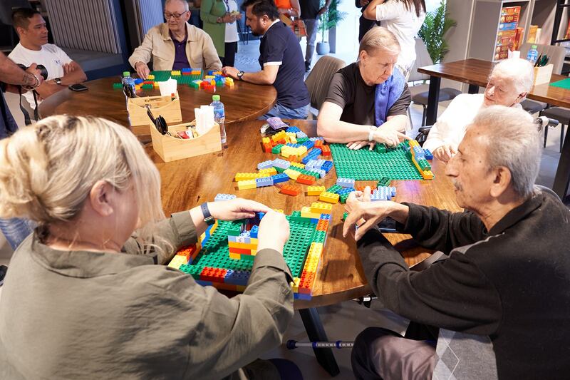 An elderly play session in Dubai led by Lego educator Saira Gulamani. Photo: Golin Mena