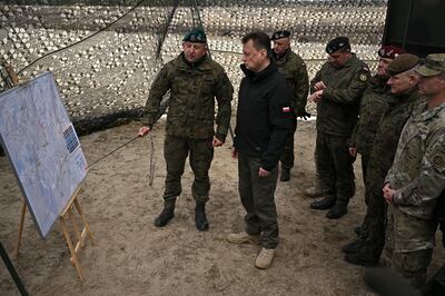 Poland's Defence Minister Mariusz Blaszczak at a military base where Polish and US troops are training together. Getty 