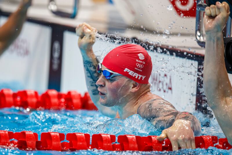 Adam Peaty of Great Britain celebrates.