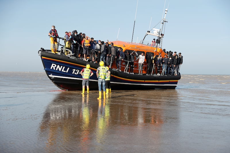 Migrants rescued from the English Channel by the Royal National Lifeboat Institution arrive at Dungeness. Reuters