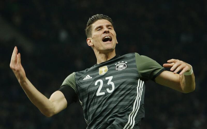 Mario Gomez celebrates scoring the second goal for Germany. Reuters / Fabrizio Bensch
