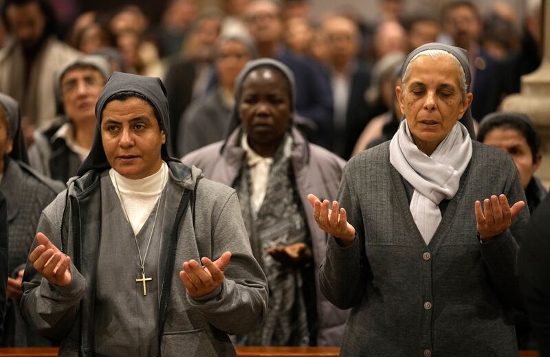 Egyptian Catholic nuns pray during the Christmas Eve mass at St Joseph's Catholic Church in Cairo. AP