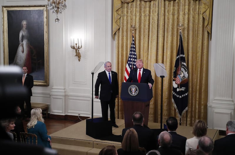 US President Donald Trump speaks as Benjamin Netanyahu, Israel's prime minister, listens during a news conference in the East Room of the White House. Bloomberg